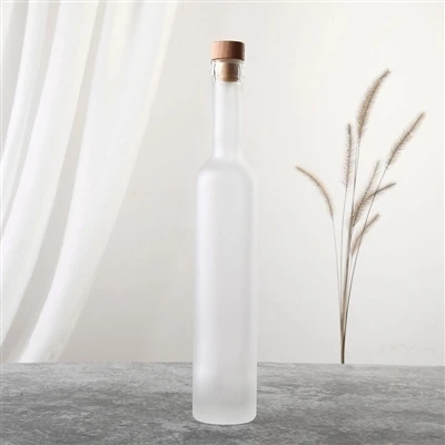 Lokket av frostede glassflasker